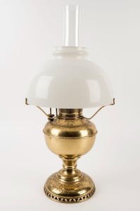 An antique American brass oil lamp with milk glass shade, 19th/20th century, 53cm high
