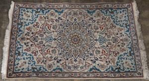 A Persian hand-knotted rug with light blue ground, ​​​​​​​137 x 88cm