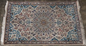 A Persian hand-knotted rug with light blue ground, 137 x 88cm