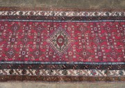 A Persian hand-knotted wool runner with crimson ground, 298 x 87cm - 2