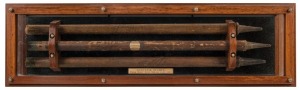 CRICKET STUMPS FROM THE BODYLINE SERIES OF 1932-33 Three stumps souvenired by team members during the Bodyline Series, attractively displayed in a timber and glass custom-built presentation case. The central stump, signed by the members of the English Tea