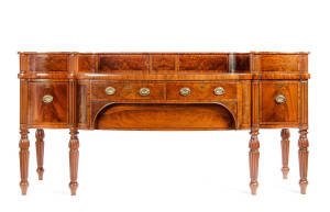 Regency mahogany sideboard. A fine bow fronted example resting on 6 turned & fluted legs with 2 tier top fitted with sliding panel doors. Height 120cm, width 226cm, depth 80cm
