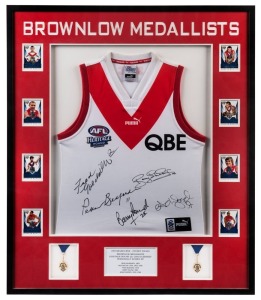 SOUTH MELBOURNE - SYDNEY SWANS: 2005 Heritage Round guernsey signed by the club's Brownlow medal winners: Fred Goldsmith, Bob Skilton, Adam Goodes, Barry Round and Peter Bedford. Attractively framed and glazed together with collector cards of the players 