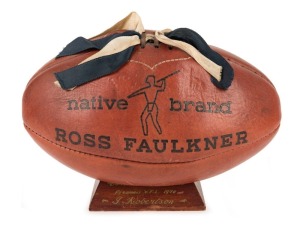 THE 1970 PREMIERSHIP TROPHY: The Ross Faulkner "native brand" football presented to IAN ROBERTSON as a member of the 1970 Carlton Premiership Team; with added blue and white ribbons, the ball is mounted on a wooden plinth engraved with "Carlton Football C