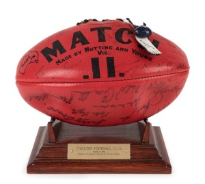 CARLTON'S 1970 PREMIERSHIP: A full-size MATCH II football by Nutting and Young, signed by the 1970 premiership squad with small blue CFC ball and "Premiers 1970" leather tags, presented on an attractive wooden stand with engrave metal plaque "CARLTON FOOT