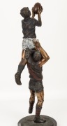 An impressive bronze statue on a black marble base, depicting a Carlton player taking a "screamer" over the shoulder of an Essendon player; overall 55cm high. - 4