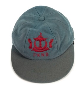 BRUNEI: Match worn national cricket team peaked woollen cap with PKNB and logo embroidered to front panel, circa 1970s. Player unknown.