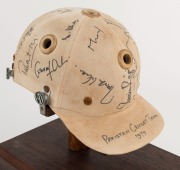 1979 PAKISTAN CRICKET TEAM: Match worn batting helmet signed by 15 members of the Pakistan touring party, attractively displayed on a custom built timber base. Accompanied by "The Pakistan Book of Test Cricket 1952-53 - 1982" by Abid and Masood as well as - 3