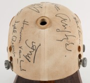 1979 PAKISTAN CRICKET TEAM: Match worn batting helmet signed by 15 members of the Pakistan touring party, attractively displayed on a custom built timber base. Accompanied by "The Pakistan Book of Test Cricket 1952-53 - 1982" by Abid and Masood as well as - 5