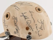 1979 PAKISTAN CRICKET TEAM: Match worn batting helmet signed by 15 members of the Pakistan touring party, attractively displayed on a custom built timber base. Accompanied by "The Pakistan Book of Test Cricket 1952-53 - 1982" by Abid and Masood as well as - 6