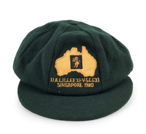 "D. K. LILLEE XI v S.C.C. XI Singapore, 1980" baggy green pure wool cricket cap with embroidered map logo of Australia & 'D.K. Lillee XI v S.C.C. x I/ Singapore 1980' to front panel, made by Albion. Fine condition. This is only the second example to come 