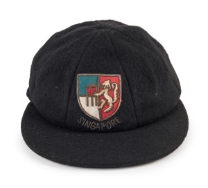 SINGAPORE CRICKET ASSOCIATION pure wool peaked cap with embroidered lion and cricket stumps logo to front panel.