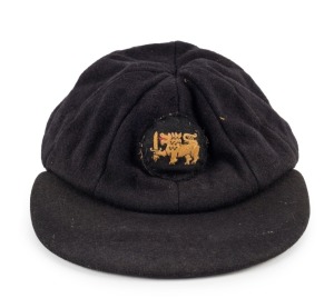 SRI LANKA cricket team woollen peaked cap with logo stitched to front panels. Match worn with owner's initials to label "M. H. T." (Michael Hugh Tissera). The interior lining is worn but exterior surfaces of the cap are in excellent condition.