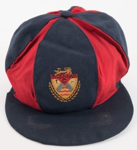 SYDENHAM CRICKET CLUB (Christchurch, New Zealand): Peaked team cap with red and navy blue panels. The Sydenham logo embroidered to front panel. Excellent condition.