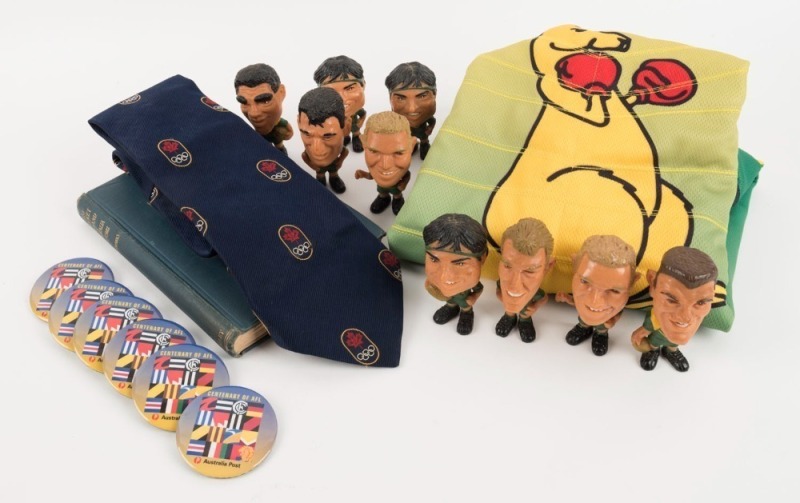 COLLECTION REMAINDER: Comprising 1921 cricket book by W. P. H. Sparks, 1976 Montreal Olympics tie, Australian Rugby League figurines circa 1990s (9), 1997 Centenary of AFL badges (6) and an Australian Olympic Team cool down and fire up top.