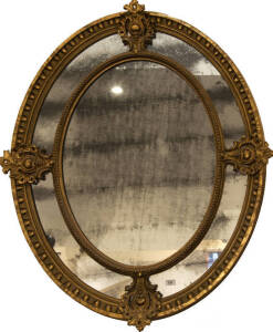 Georgian ornate oval gilt framed mirror with original glass. 110 x 128cm
