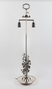 An unusual silver plated lamp with floral adornment and laurel wreath top, 20th century 103cm high