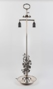 An unusual silver plated lamp with floral adornment and laurel wreath top, 20th century ​​​​​​​103cm high&nbsp;