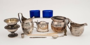 Two Georgian sterling silver jugs, sterling silver mustard pot, glass liners, pair of Sheffield plate salts, bone glove stretcher, silver thimble, swizzle stick, miniature statue, and a silver finished jug, (11 items), 275 grams silver weight