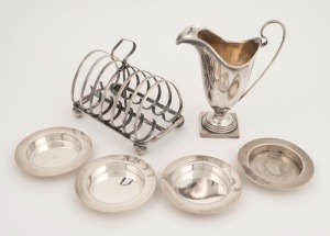 A Georgian sterling silver helmet cream jug, a sterling silver toast rack, plus four sterling silver dishes, 19th/20th century, (6 items) 14cm high, 480 grams total
