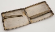 A Continental silver cigarette case with remains of enamel decoration, circa 1930, 10cm wide, 174 grams - 2