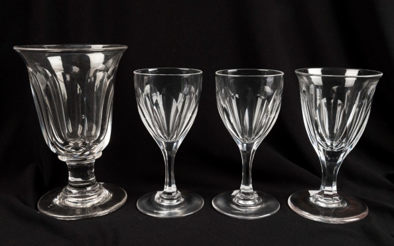 Four assorted antique glasses with faceted decoration, 19th century, the largest 14cm high