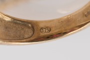 A 9ct yellow gold ring, set with three rosettes of rubies with two rows of white diamonds, 20th century, stamped "375", 4.2 grams - 2