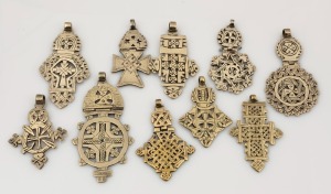 Ethiopian Coptic cross pendants, cast bronze with remains of silver finish, 19th/20th century, ​​​​​​​the largest 10.5cm high overall