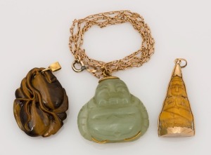 Three assorted Chinese carved hard stone pendants, all mounted in gold, one with 9ct gold chain, 19th/20th century, ​​​​​​​the largest 4cm high