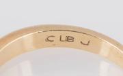 An 18ct yellow gold ring, set with a row of three white diamonds, 20th century, 3.2 grams - 3