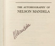 NELSON MANDELA (1918 - 2013) strong pen signature on the title page of his autobiography, "Long Walk to Freedom"; attractively box-framed in combination with a photograph and plaque, overall 41 x 63cm. Accompanied by a signed note dated May 2001 indicati - 2