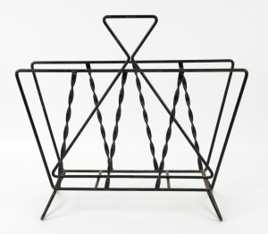 A vintage black metal magazine holder, mid 20th century, 42cm high, 43cm wide