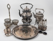 Silver plated table ware including two spirit kettles, cruet set, wine bottle coaster, salts, tray, bon bon dish and centrepiece stand with glass liners, 19th and 20th century, ​​​​​​​the tray 40cm diameter