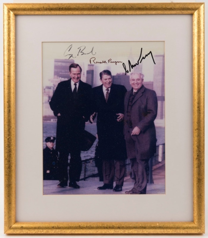 President RONALD REAGAN and Vice President GEORGE H.W. BUSH meeting with USSR General Secretary MIKHAIL GORBACHEV on Governor’s Island, New York, December 7, 1988 colour photograph signed by all three, framed and glazed 37.5 x 32.5cm overall