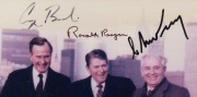 President RONALD REAGAN and Vice President GEORGE H.W. BUSH meeting with USSR General Secretary MIKHAIL GORBACHEV on Governor’s Island, New York, December 7, 1988 colour photograph signed by all three, framed and glazed 37.5 x 32.5cm overall - 2