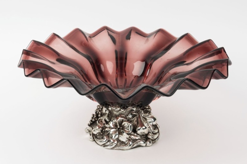 A cranberry glass fruit bowl with silver finished base, 20th century, 16cm high, 35cm wide