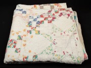 An antique American patchwork quilt, handmade in cream and pastel colours, early 20th century, 175cm x 200cm&nbsp;