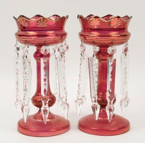 A pair of ruby glass mantle lustres, 19th century, 27cm high