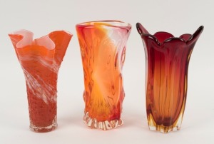 Three assorted orange art glass vases, 20th century, the largest 22cm high