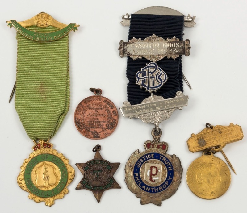 Group of five assorted medals and badges, 20th century