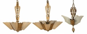 Three Art Deco cast metal and pressed glass ceiling pendant lights, circa 1930s, the largest 95cm high overall