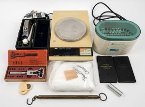 A.N.D. Electronic balance scales (grams, carats, ounces, pounds and pennyweights), an EO Ultrasonic jewellery cleaner, a Chelsea filter, a Topcon refractometer, 2 Moe diamond weight calculators, a Universal watch case opener, brass spring scales, and a Di