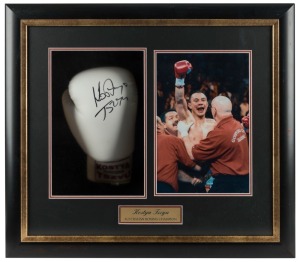 KOSTYA TSZYU: A signed self-branded full-size boxing glove, attractively box-framed together with a photograph of Tszyu in post-bout triumph and a name panel. Overall 51 x 58 x 15.5cm.
