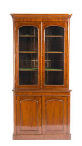 BOOKCASE: Victorian mahogany with arched panel doors & glazed top section. Height 225cm, width 155cm, 90cm