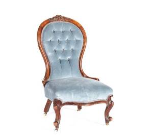 LADIES CHAIR: Victorian carved walnut frame with blue velvet upholstery, c1880s.