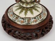 ZOLNAY antique Hungarian porcelain urn on later carved Chinese wooden base, blue factory mark to base. Note: missing lid, 31cm high overall - 8