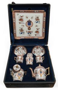LOUIS XVIII boxed porcelain bachelor's tea set by SAMPSON of Paris, 19th century, in original plush case. Bearing an old Sotheby's lot number. the case 37cm wide