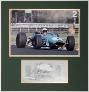 JACK BRABHAM (1926-2014) signed card mounted together with a photo of Brabham at the wheel of one of his winning F1 cars; with CofA.