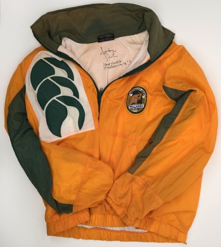 AUSTRALIAN WALLABIES: Track suit jacket with embroidered Wallabies logo, signed by Andrew Denton who has added "Never played for the Wallabies in my life!"