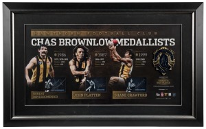 Hawthorn FC signed Brownlow official print with replica Brownlow Medal. Llimited edition #21 of 200. Signed by Robert Dipierdomenico, John Platten and Shane Crawford. Official AFLPA CoA included. ​​​​​​​53 x 85cm overall